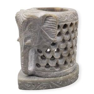 Carved soapstones elephant figurine
**is missing bottom stand** candle holder